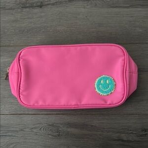 Cheerful Pink Pouch with Smiley Emblem